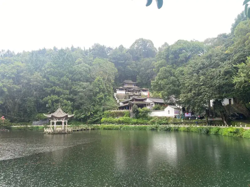 Dawn mist over Heshun's Dragon Pond and the laundry pavilions