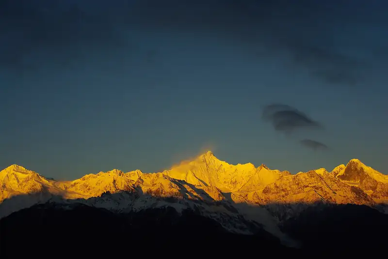 Kawagebo, the highest peak of the Meili Snow Mountains, catching early light